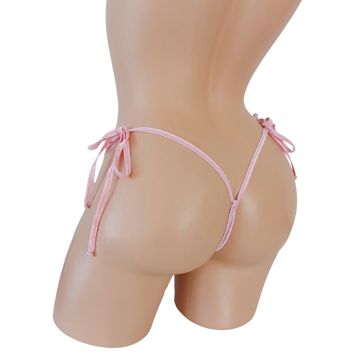 Back view of Baby Pink lace thong with side ties on a curvy mannequin.