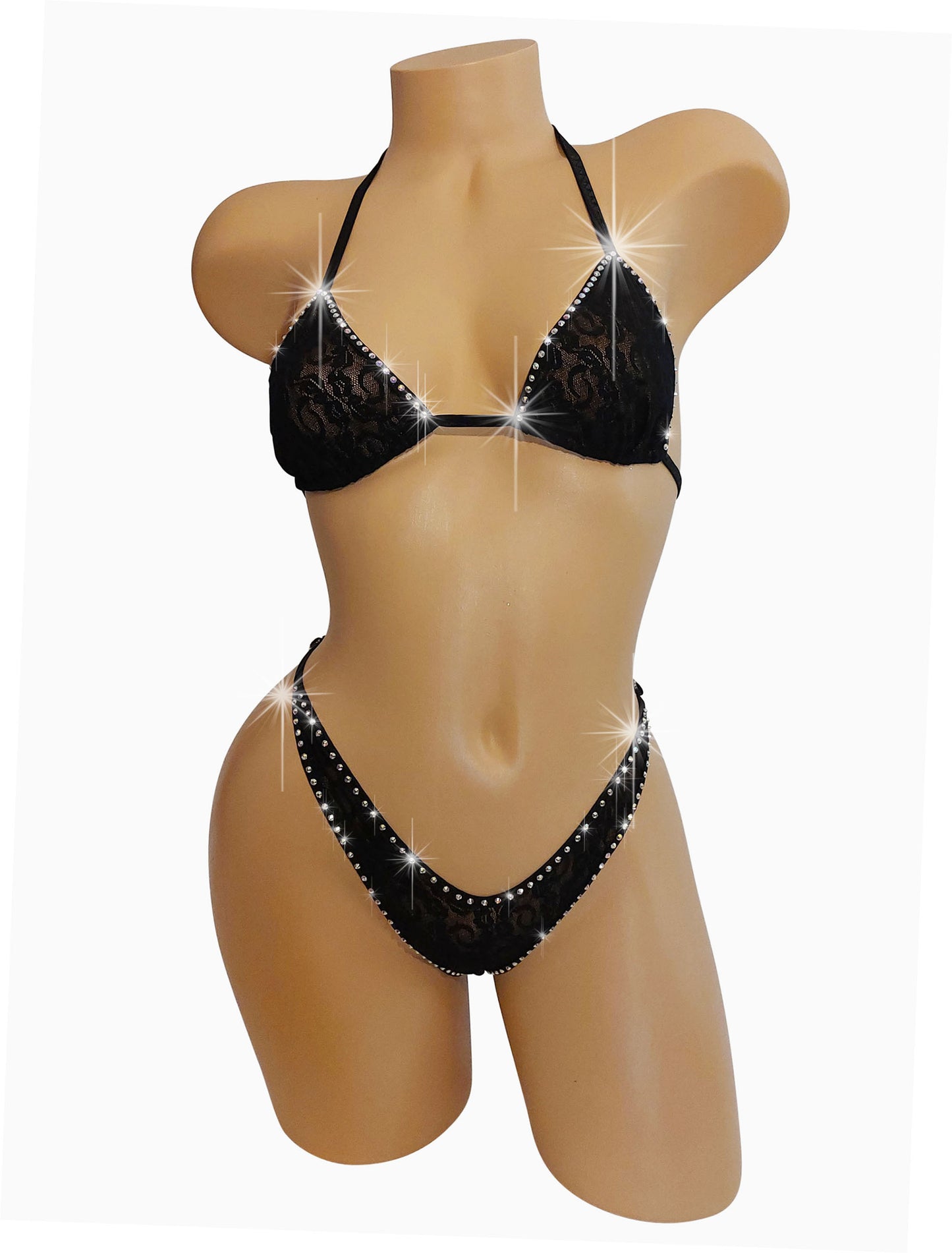 A mannequin showcasing a rhinestone-studded black lace bikini with adjustable straps.