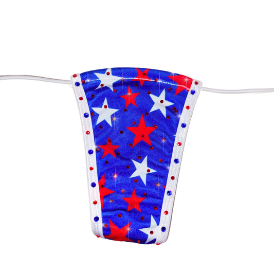 A rhinestone bedazzled red, white, and blue flag like thong with star pattern lying on a white background