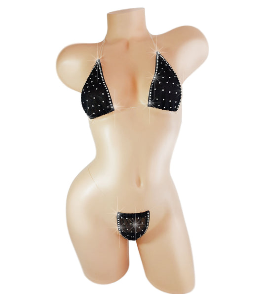 Black mesh halter top and g-string covered in crystal rhinestones on a sexy mannequin.