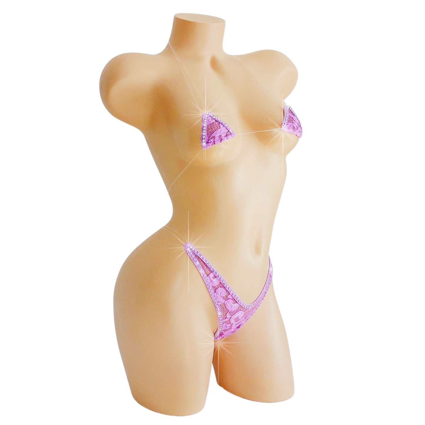 Extreme micro purple lace bikini outlined with crystal rhinestones on a mannequin.
