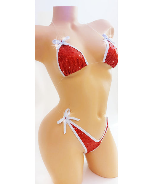 Bikini in Red hologram with white sparkle trim and bows, covered in red rhinestones with clear elastic invisible straps, on a mannequin.