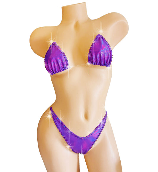 Clear elastic invisible strap thong bikini in Purple reflective spandex with purple blue rhinestones, on a mannequin.