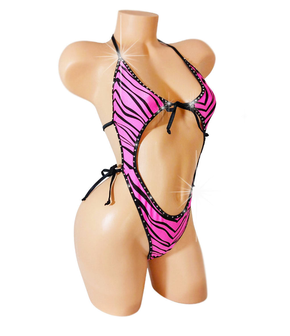 One piece bathing suit with cutouts in Pink Zebra fabric with rhinestone trim.
