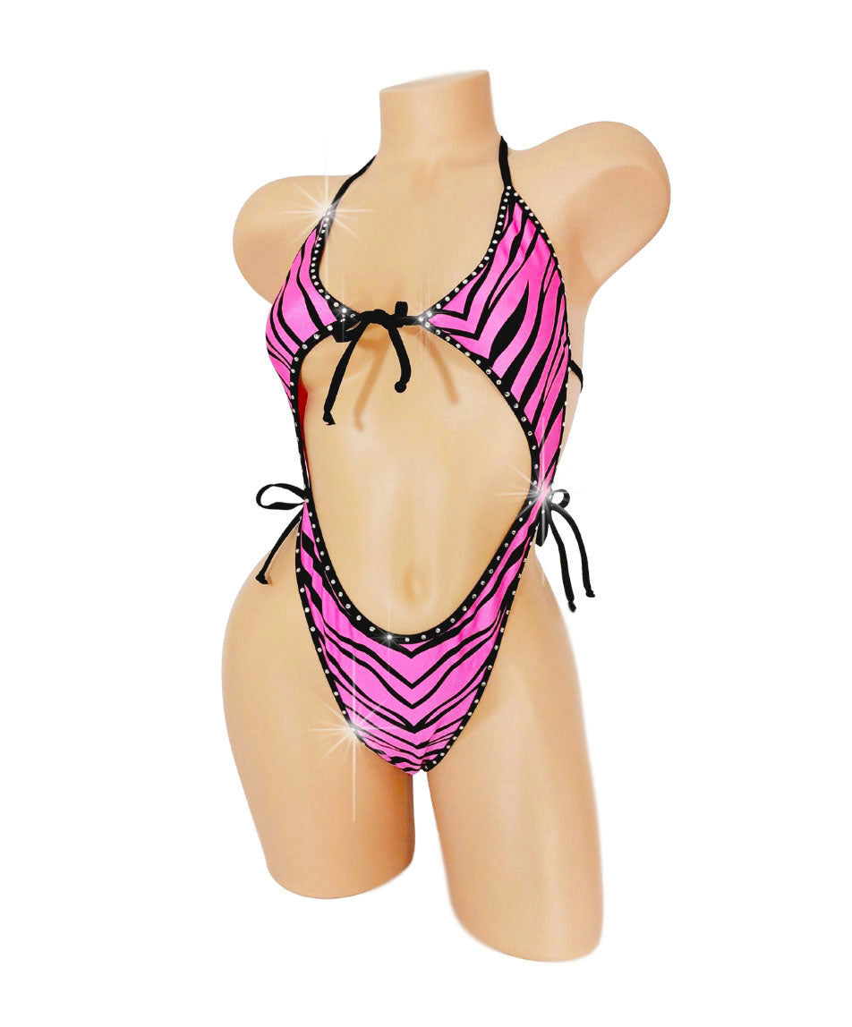 One piece bathing suit with cutouts in Pink Zebra fabric with rhinestone trim.