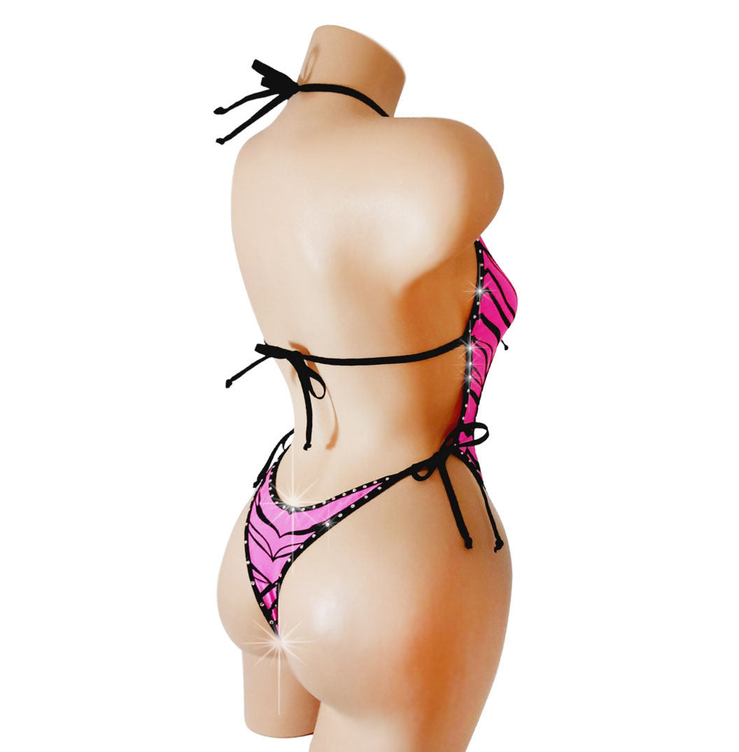 One piece bathing suit with cutouts in Pink Zebra fabric with rhinestone trim.