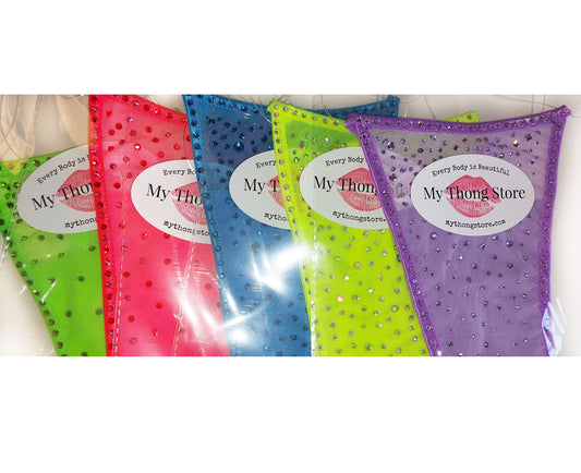 Product shot of multiple colored Semi-sheer bikinis covered in rhinestones.