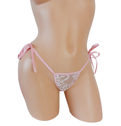 Baby Pink lace thong with side ties on a curvy mannequin.