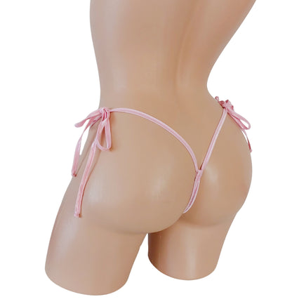 Back view of Baby Pink lace thong with side ties on a curvy mannequin.