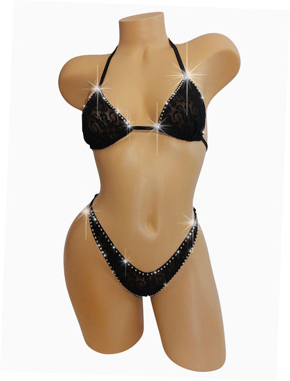 A mannequin showcasing a rhinestone-studded black lace bikini with adjustable straps.