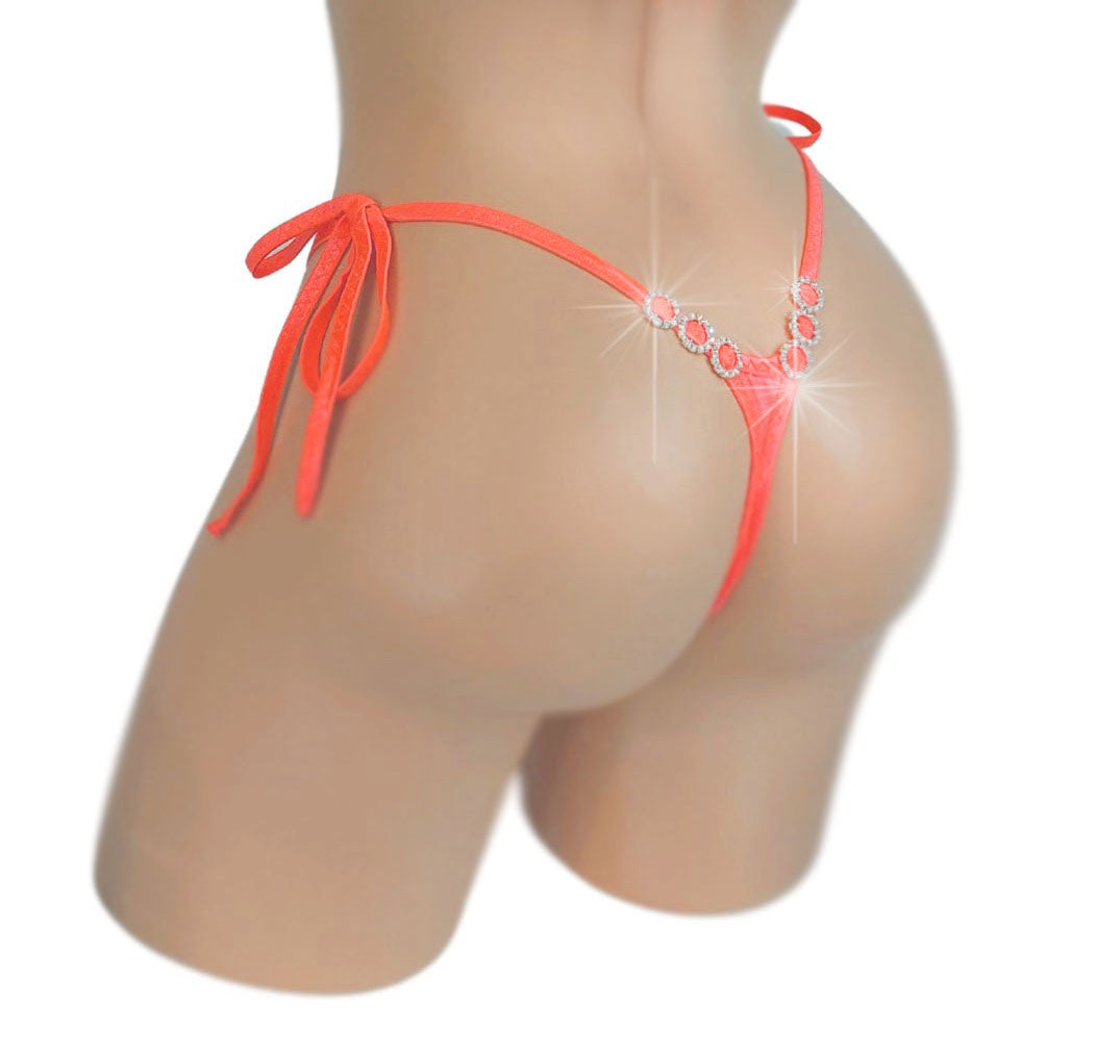 Rear view of Glow Peach diamond accent tie side thong on a mannequin.