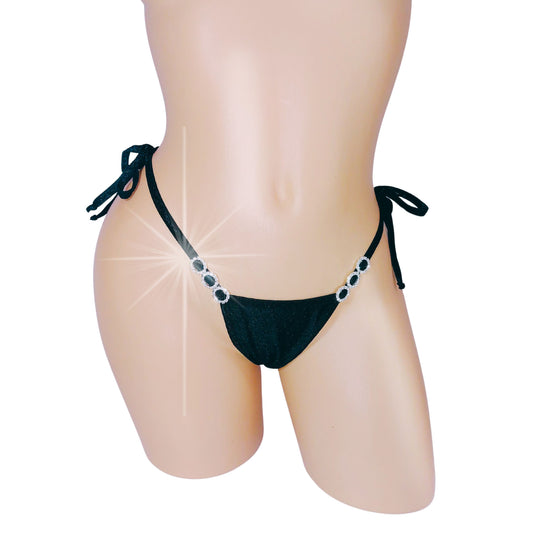 Black diamond accented tie side thong on a curvy mannequin torso.