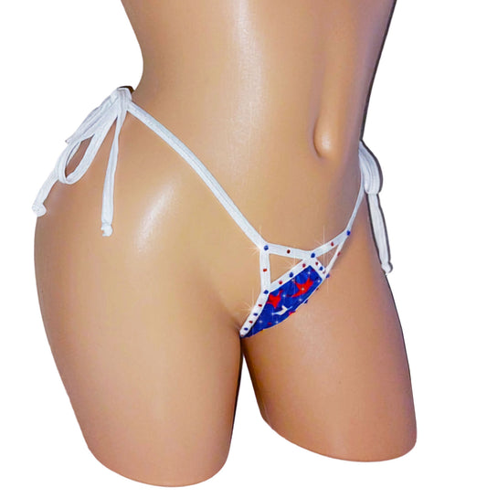 Red, white and Blue flag type bikini bottom with bedazzled rhinestone star design and white tie side straps on a mannequin against a white background