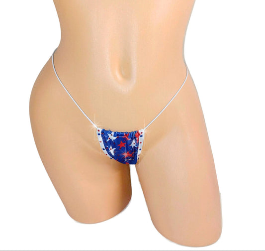bedazzled Flag micro bikini thong g-string bottom wtith tons of bedazzled crystal rhinestones! Rich blue background with little wavy white lines like a flag behind vibrant rhinestoned red and white stars.
