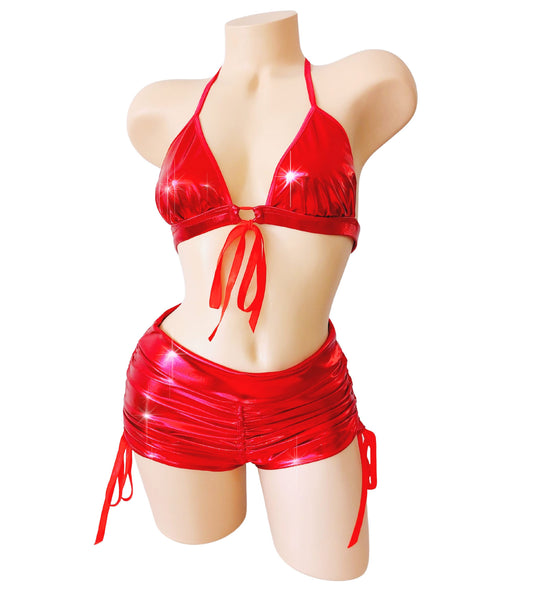 Red metallic short shorts with gathers and a tie front red bra top on a sexy mannequin.