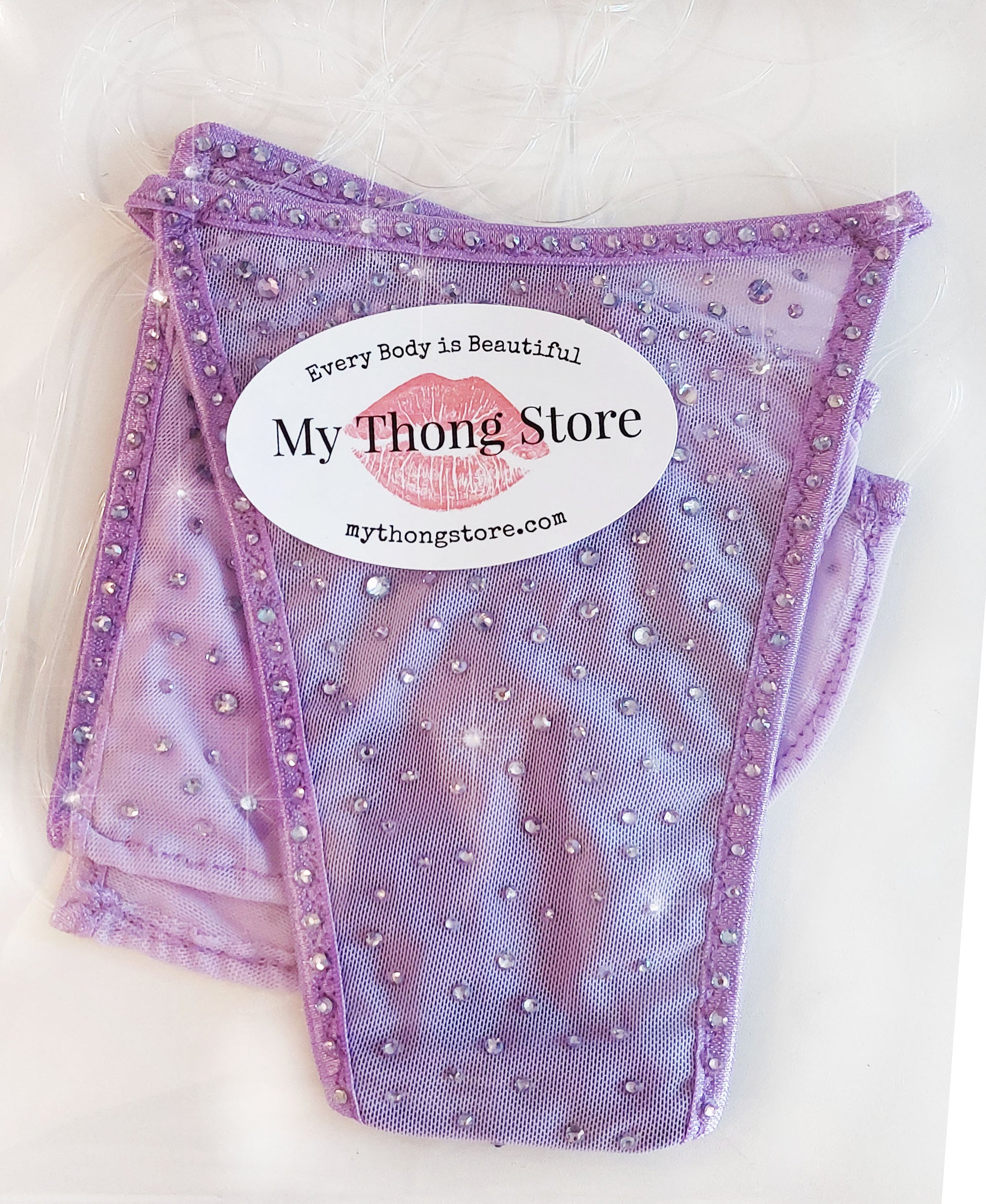 Product shot of Semi-sheer Lilac bikini covered in rhinestones.