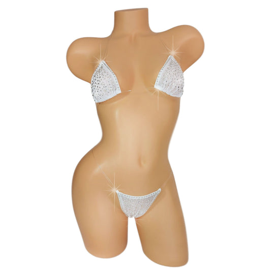 Product shot of White mesh invisible strap string bikini thong covered in diamond rhinestones on a white background.