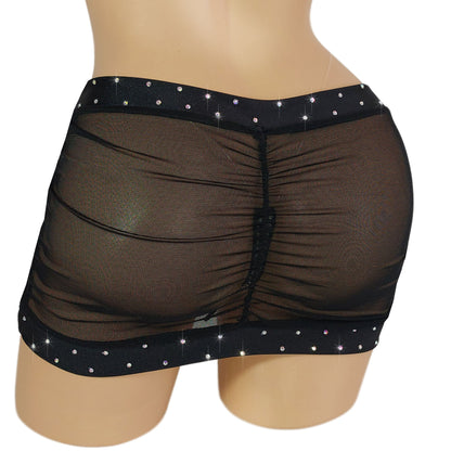 Back view of Black mesh  rhinestone micro mini skirt on a mannequin.
