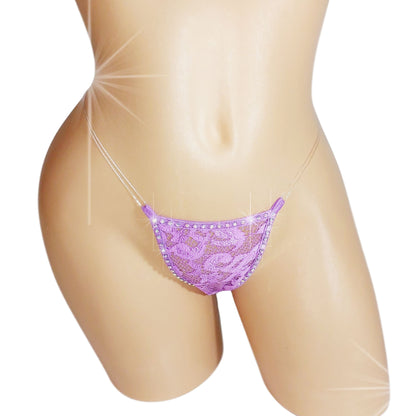 A purple lace thong with clear elastic and sparkling crystal rhinestones on a mannequin. The thong is fully lined and not see-through.