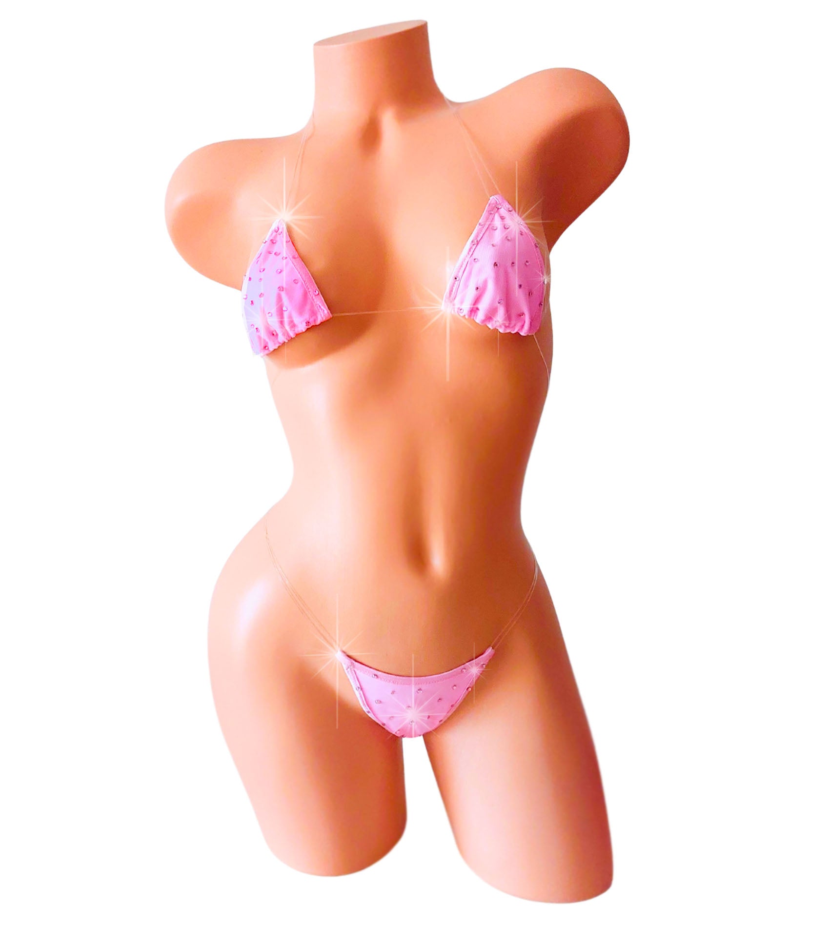 Mannequin wearing a pink bikini on a white background