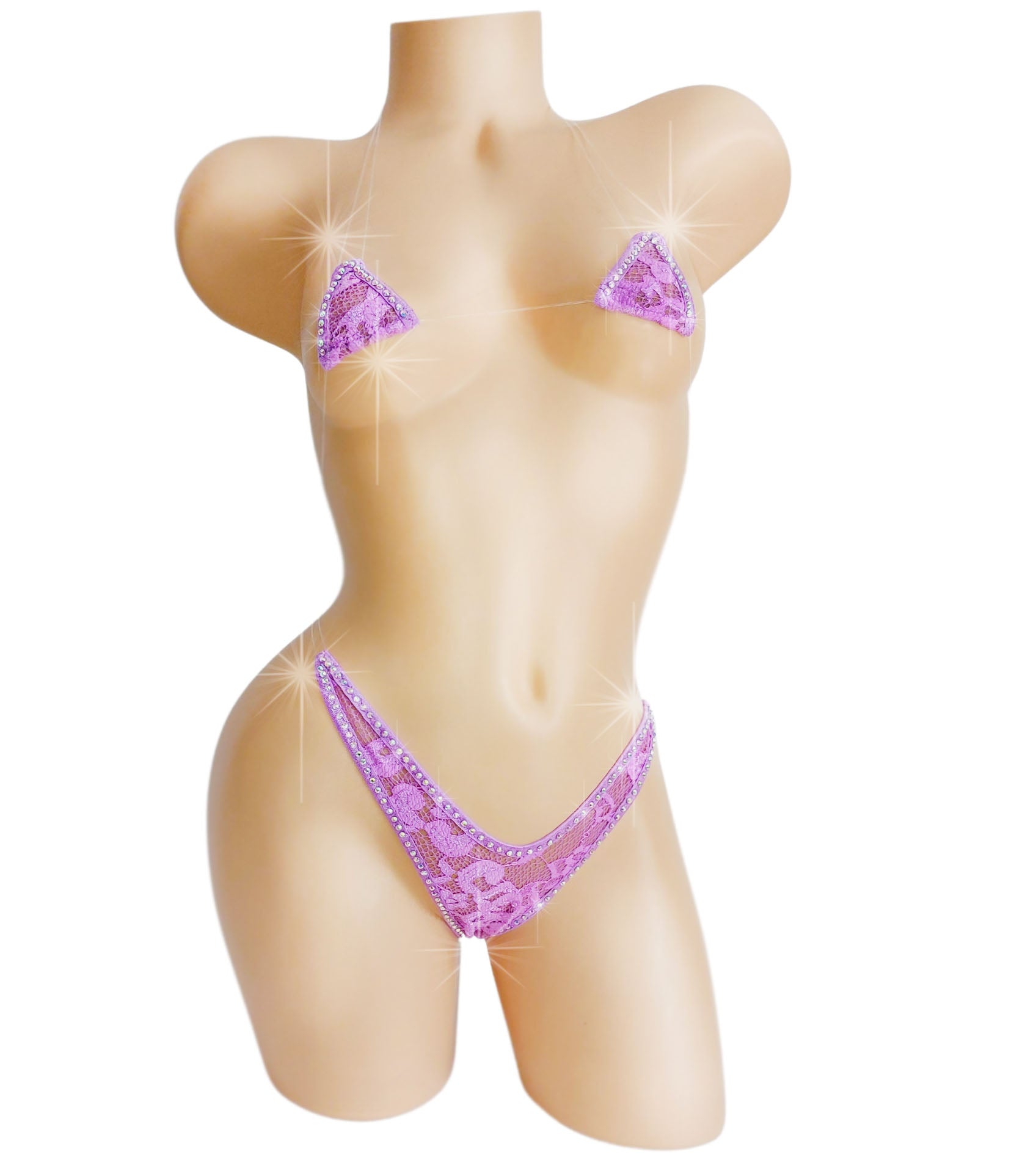 Extreme micro purple lace bikini outlined with crystal rhinestones on a mannequin.