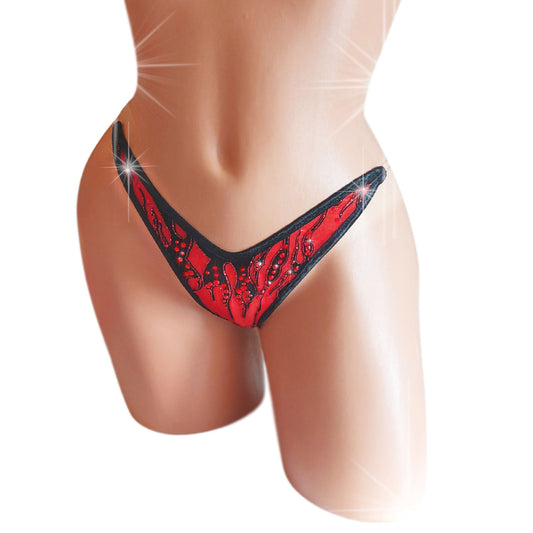 Red mesh lingerie thong with black and red glitter accents and red rhinestones on a sexy mannequin.