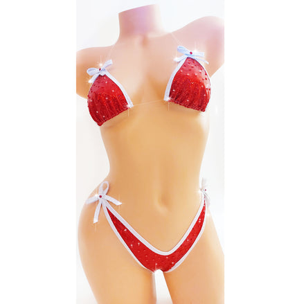 Bikini in Red hologram with white sparkle trim and bows, covered in red rhinestones with clear elastic invisible straps, on a mannequin.