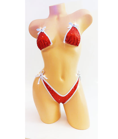 Bikini in Red hologram with white sparkle trim and bows, covered in red rhinestones with clear elastic invisible straps, on a mannequin.