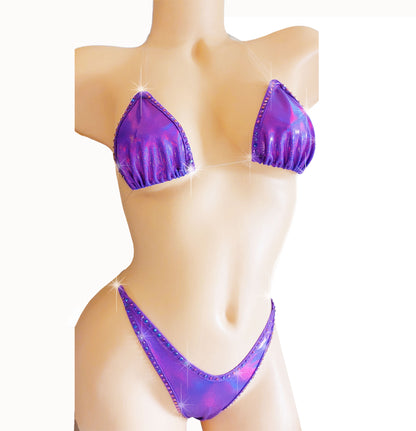 Clear elastic invisible strap thong bikini in Purple reflective spandex with purple blue rhinestones, on a mannequin. 