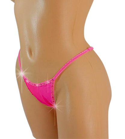 Shocking hot pink bedazzled rhinestone thong with adjustable straps on a mannequin.