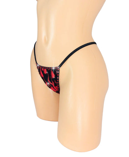 Photo of a sexy thong in Red flame fabric with black trim on a curvy mannequin on a white background.