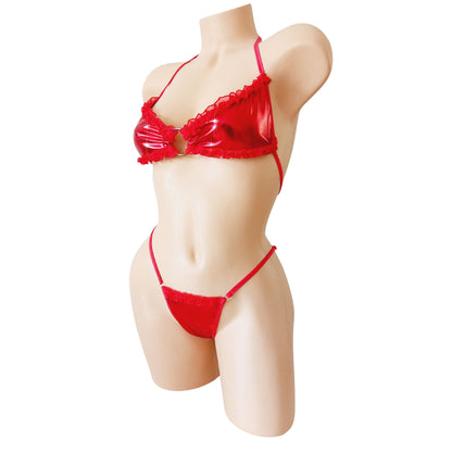 Sexy metallic red red mesh ruffled two piece g-string thong bikini on a curvy mannequin, on a white background.
