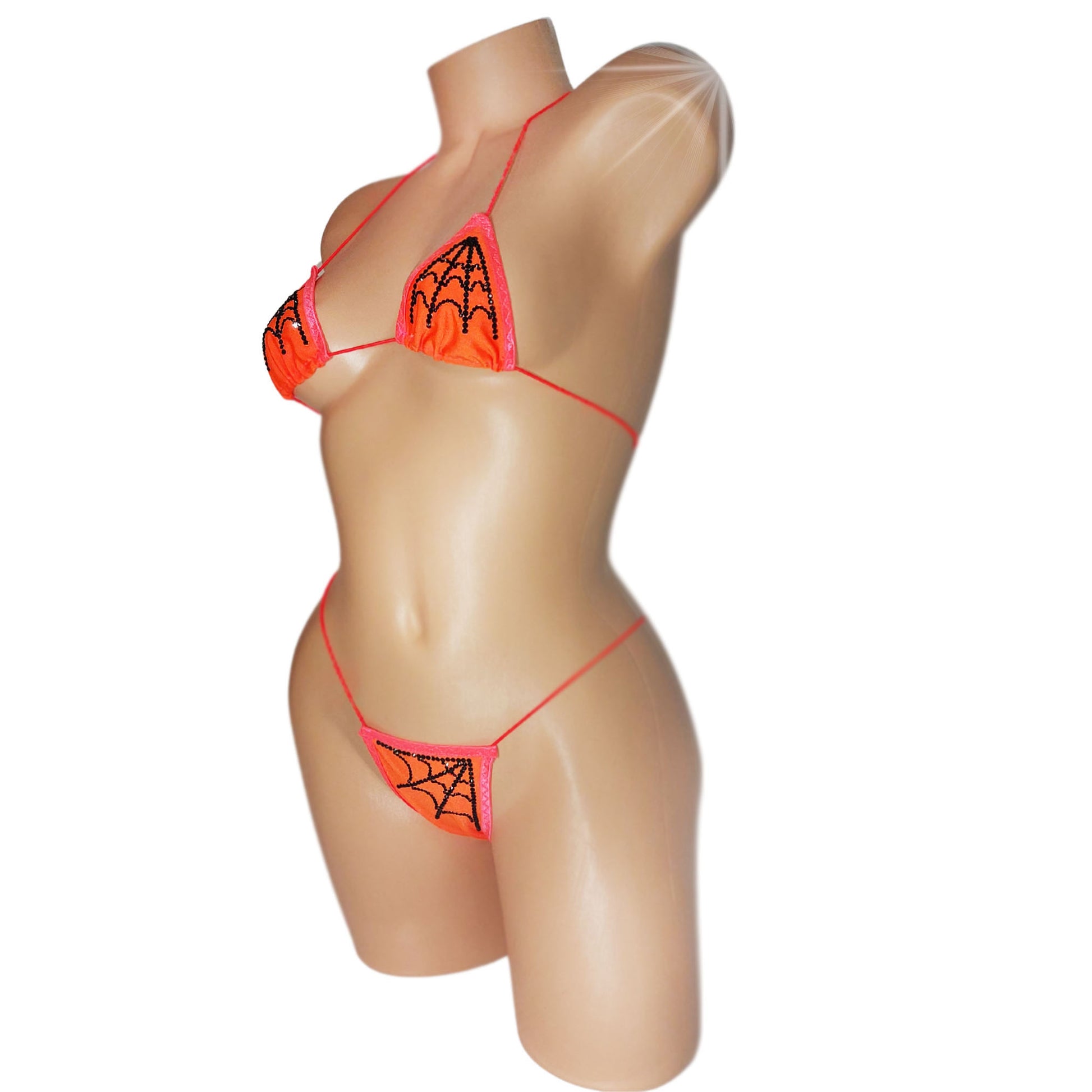 Sexy Orange Halloween bikini with black rhinestone spiderweb pattern on a curvy mannequin.