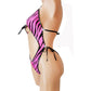 One piece bathing suit with cutouts in Pink Zebra fabric with rhinestone trim.