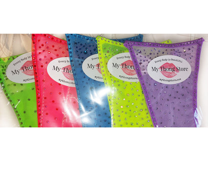 Product shot of multiple colored Semi-sheer bikinis covered in rhinestones.