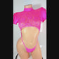 Video of Hot Pink lace crop top with lacy ruffled short sleeves, covered in rhinestones, with an attached rhinestone thong, on a curvy mannequin.