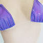 Hand held video of Irridescent purple thong with color changing rhinestones.