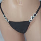 Video of Black diamond accented tie side thong on a curvy mannequin torso.