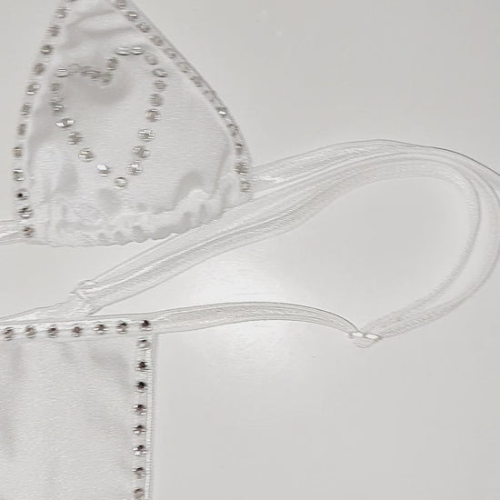 Video of Rhinestone heart white bikini set on a sexy mannequin.