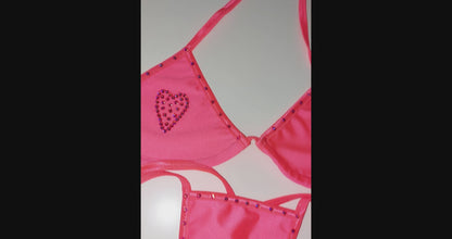 Video of product Heart rhinestone tie bikini in the color Cantalope  and  displayed also on a sexy mannequin 