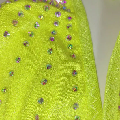 Video of Yellow thong with rhinestones on a sexy mannequin form and product shots.