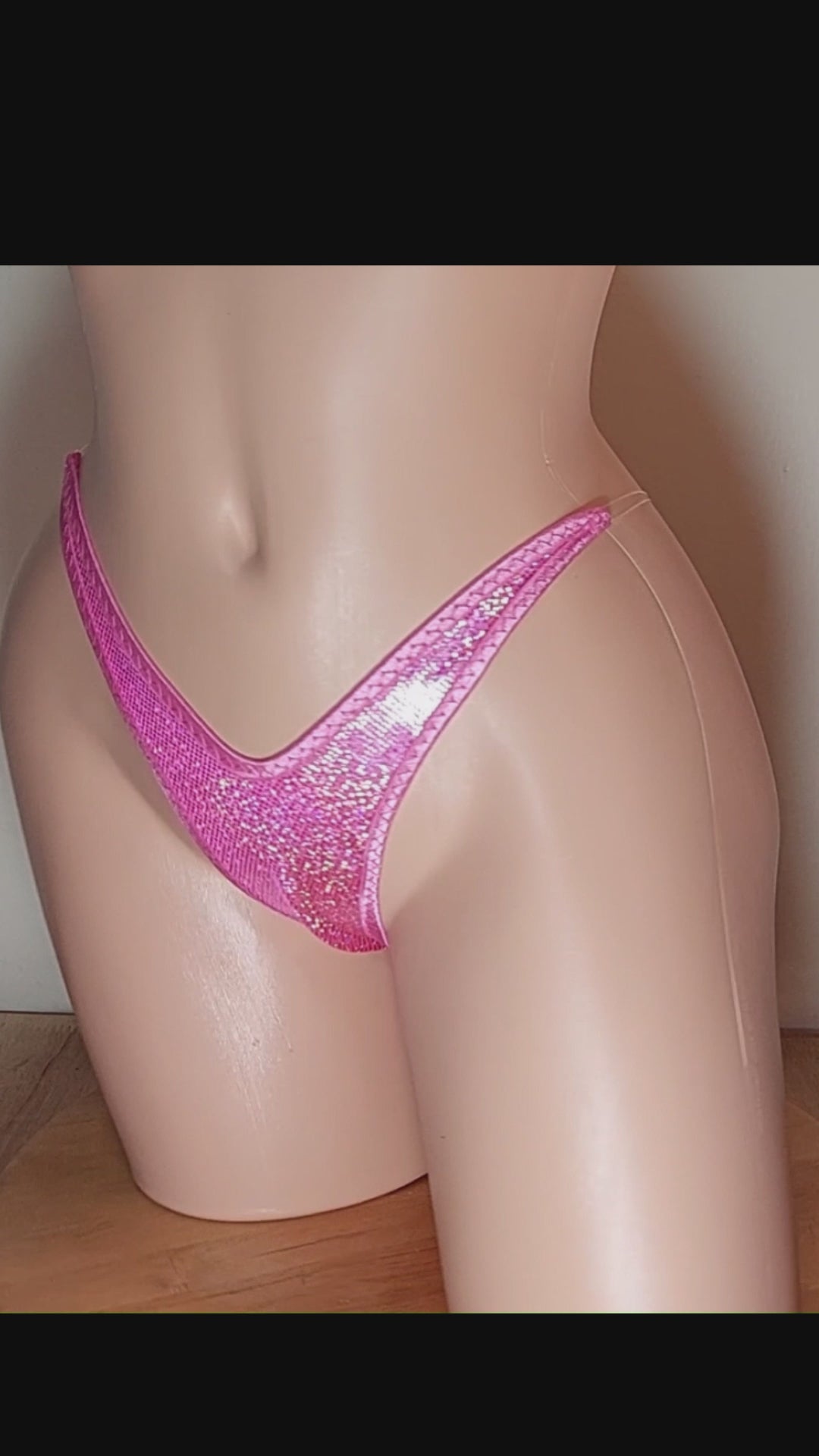 Video of Pink hologram thong on a sexy mannequin with invisible elastic.