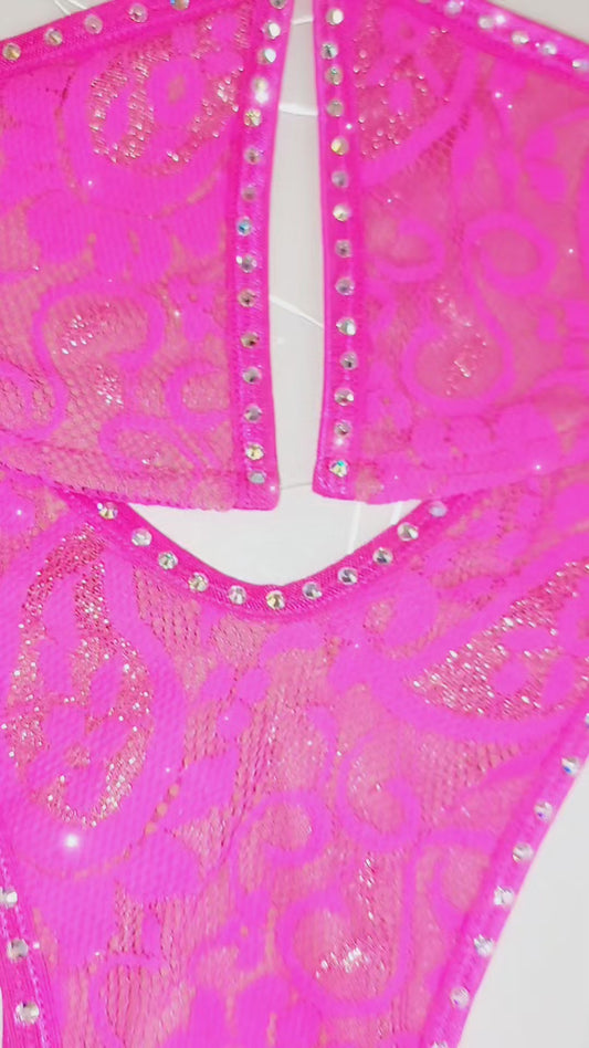Hot Pink lace microkini bikini outlined in crystal rhinestones with clear elastic strings laid flat on a white background.