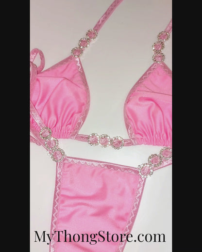 Video of Baby Pink and diamond sexy tie side bikini on a curvy mannequin.