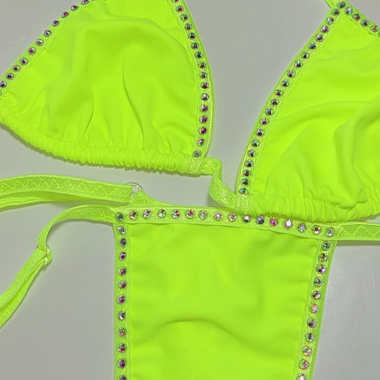 Video of Sexy bright neon yellow bikini on a curvy mannequin.