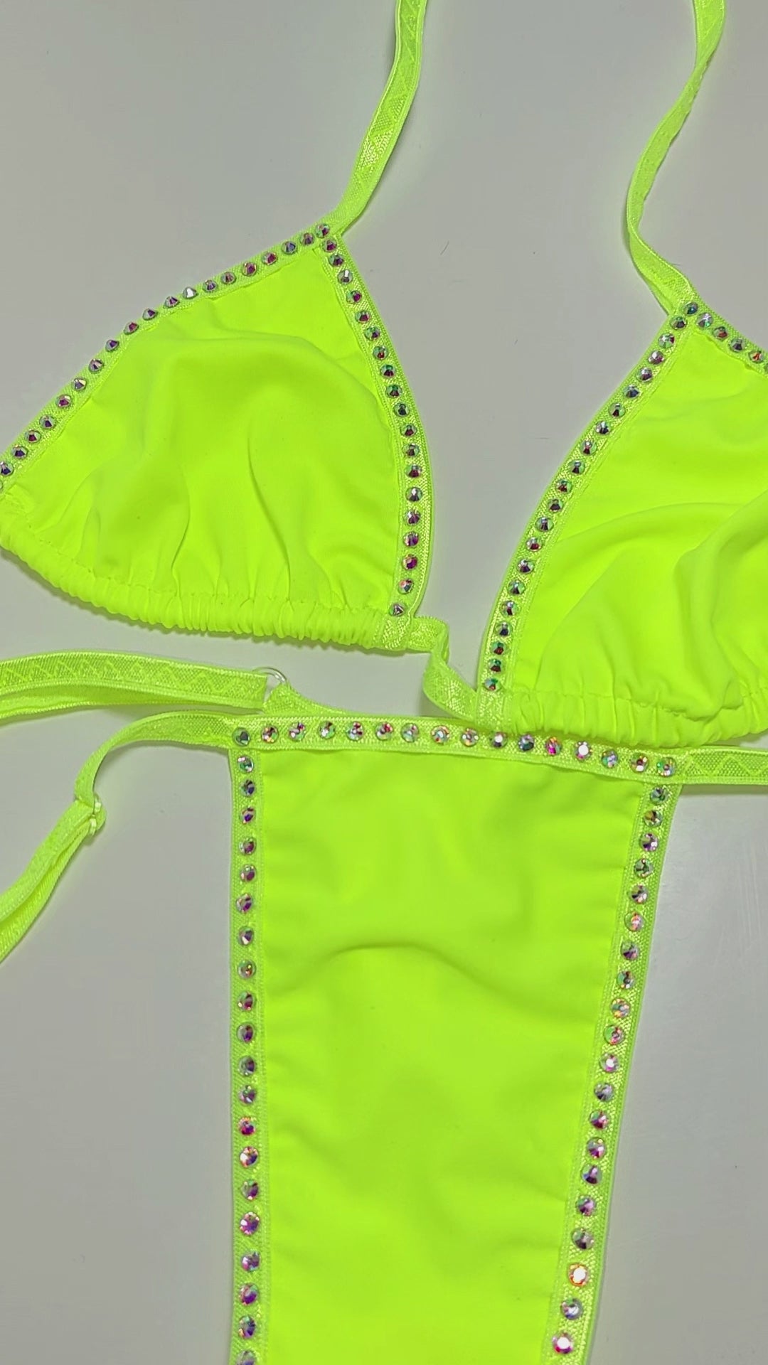 Video of Sexy bright neon yellow bikini on a curvy mannequin.