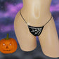 Sparkly Spiderweb Halloween novelty g-string thong, with a pumpkin.