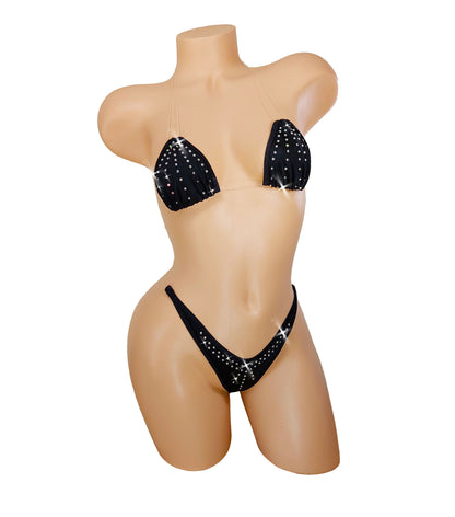 Black bikini with sparkling rhinestones on a mannequin. The straps are invisible thread so it looks like it is defying gravity.