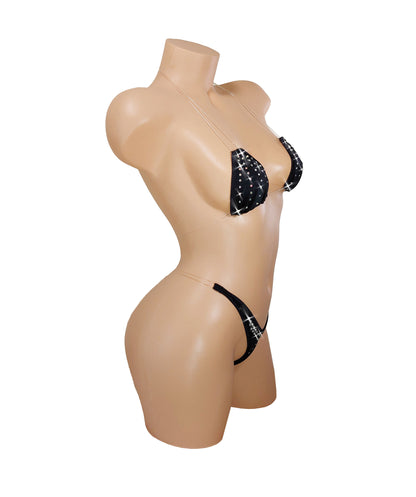 Black bikini with sparkling rhinestones on a mannequin. The straps are invisible thread so it looks like it is defying gravity.